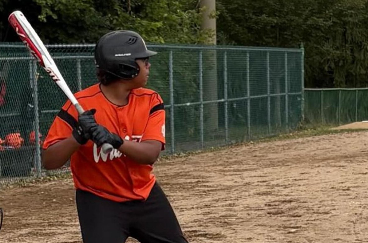 Orange Wildcat at bat