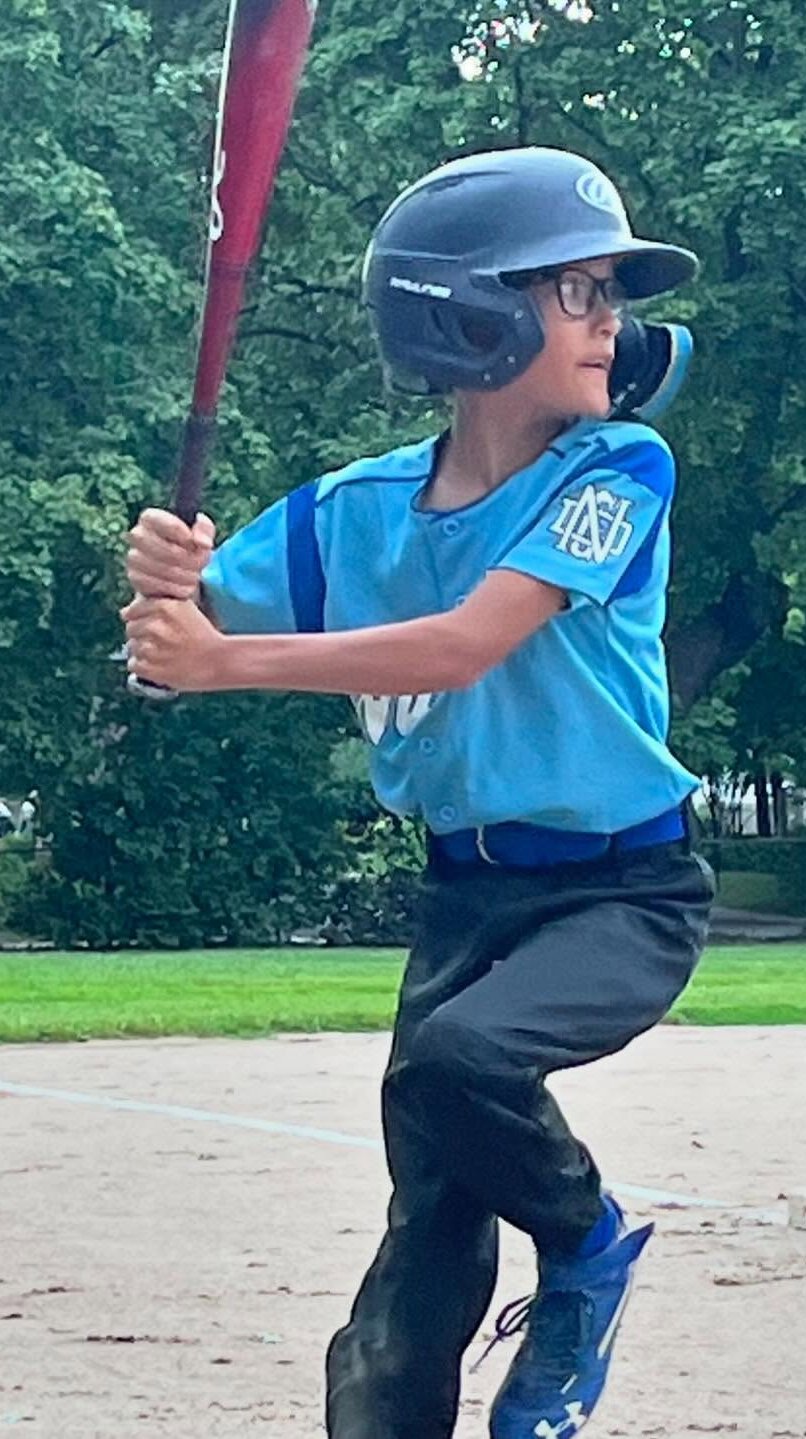 Baseball player swinging the bat